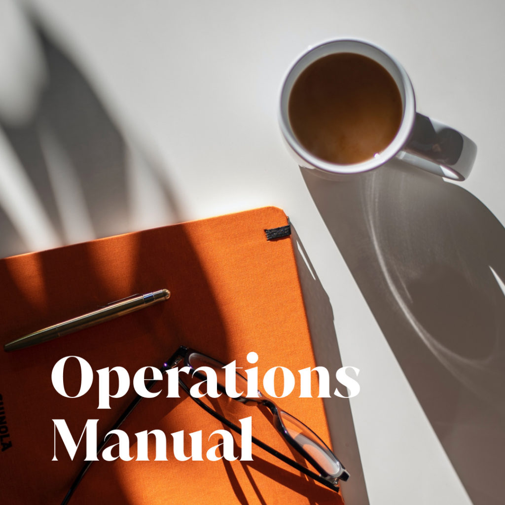 Operations Manual text over image of notebook, glasses, and coffee cup shot from above